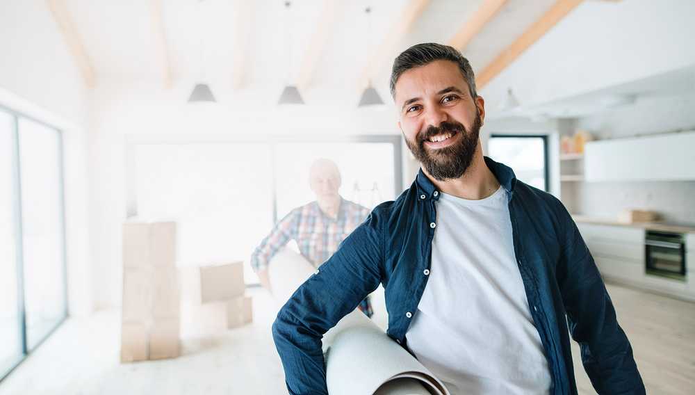 Image with a tradesman carrying a rug