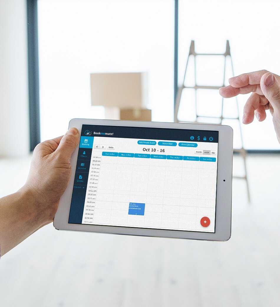 Man holding a tablet with Bookmemate's booking calendar shown